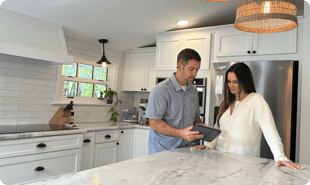 technician-talking-wtih-customer-in-kitchen